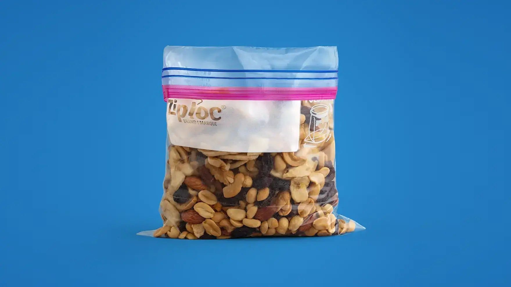Ziploc medium quart-sized storage bag filled with mixed nuts.